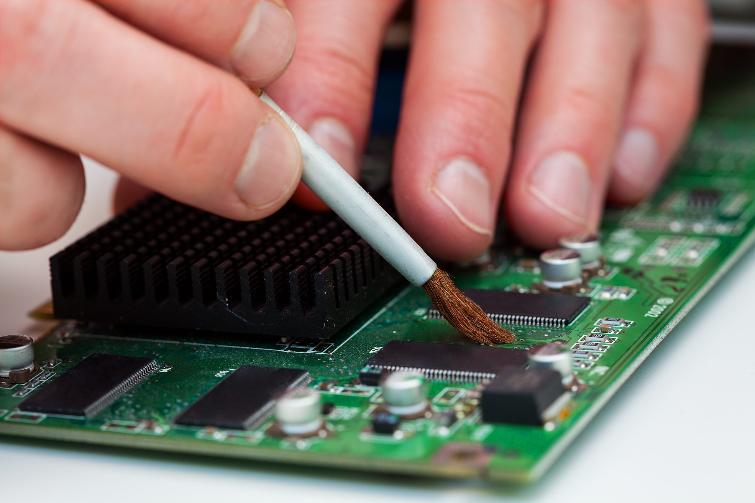 Application of conformal coating by brushing