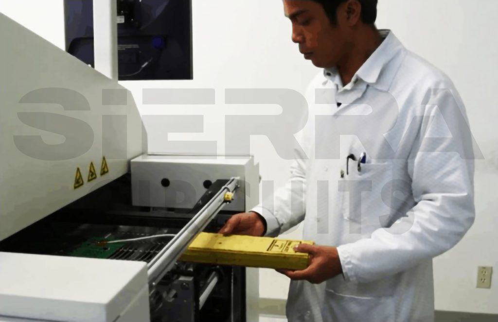 an-operator-working-on-reflow-soldering-oven.jpg